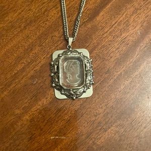 Silver Cameo pendant necklace.  Chain length approximately 24 inches.